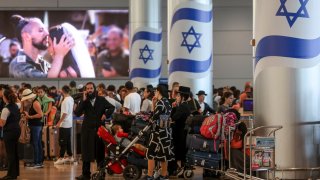 Passengers wait for their flights at Ben Gurion airport near Tel Aviv on August 6, 2024, amid regional tensions during the ongoing war between Israel and the Palestinian Hamas movement in the Gaza Strip. 