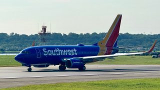 A Southwest Airlines Boeing 737-7Q8 takes off from Ronald Reagan Washington National Airport in Arlington Virginia on August 13, 2024. 