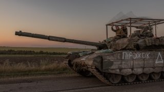 Ukrainian servicemen operate a tank on a road near the border with Russia, in the Sumy region of Ukraine, on August 14, 2024. The Ukrainian army entered Russia’s Kursk region on August 6, capturing dozens of settlements in the biggest offensive by a foreign army on Russian soil since World War II. 