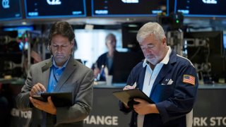 Traders work the floor of the New York Stock Exchange on August 16, 2024. 