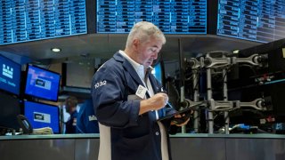 Traders work on the floor of the New York Stock Exchange on Aug. 16, 2024.