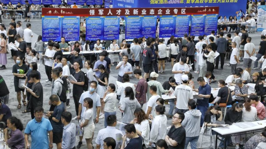 People visit a job fair on July 20, 2024 in Zhangjiagang, Jiangsu Province of China. 