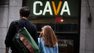 Customers arrive at a Cava restaurant in New York City on June 22, 2023.