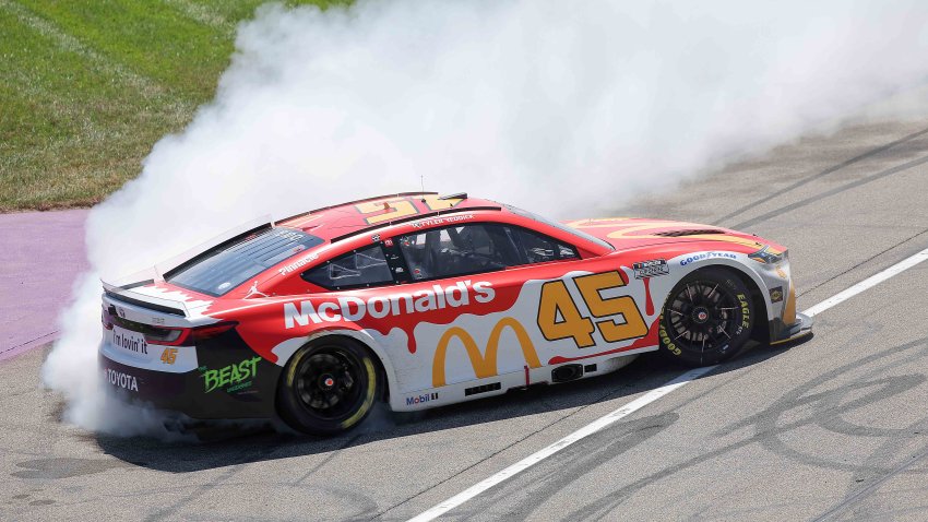 Tyler Reddick, driver of the No. 45 McDonald's Toyota, celebrates with a burnout