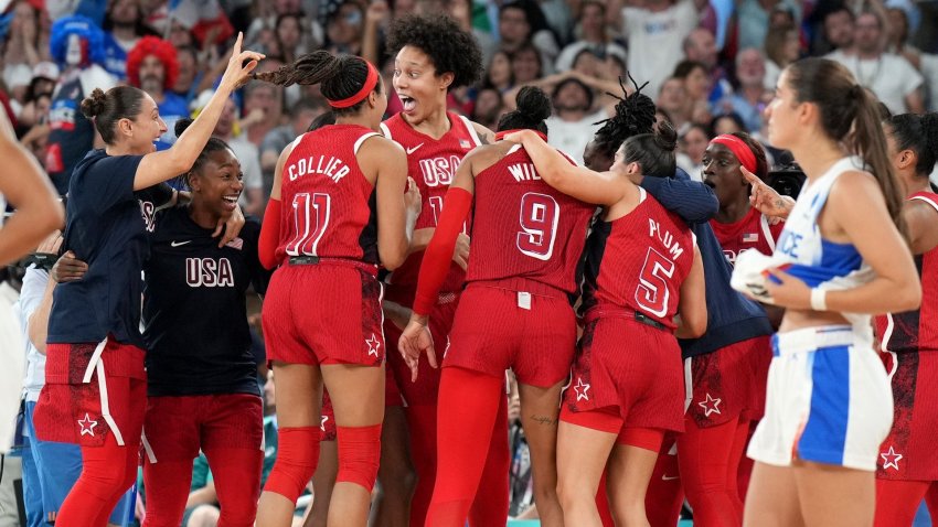 USA Basketball celebrates a gold medal