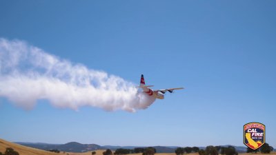 Watch a C-130 Hercules modified to fight wildfires take flight