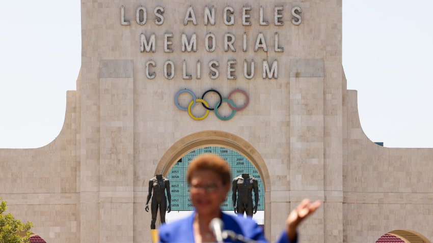 LOS ANGELES-CA-JULY 18, 2024: Mayor Karen Bass speaks at an event with local leaders to host U.S. Secretary of Transportation Pete Buttigieg and highlight nearly $80 million in new funding to electrify L.A.’s bus system to build toward a greener, more sustainable region ahead of the 2028 Olympic and Paralympic Games, in front of the Los Angeles Memorial Coliseum on July 18, 2024. (Christina House / Los Angeles Times via Getty Images)