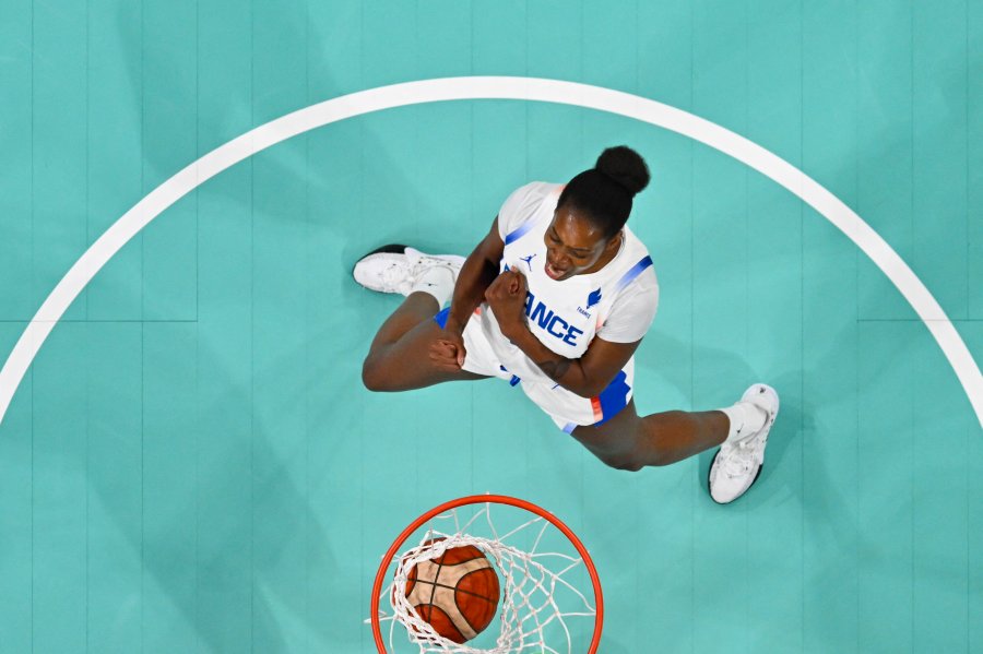 France's #11 Valeriane Ayayi celebrating scoring a basket