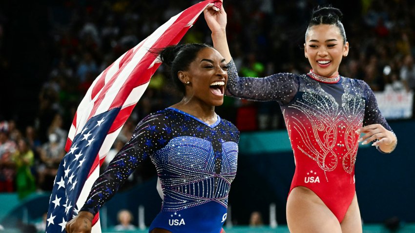 Simone Biles and Sunisa Lee celebrate