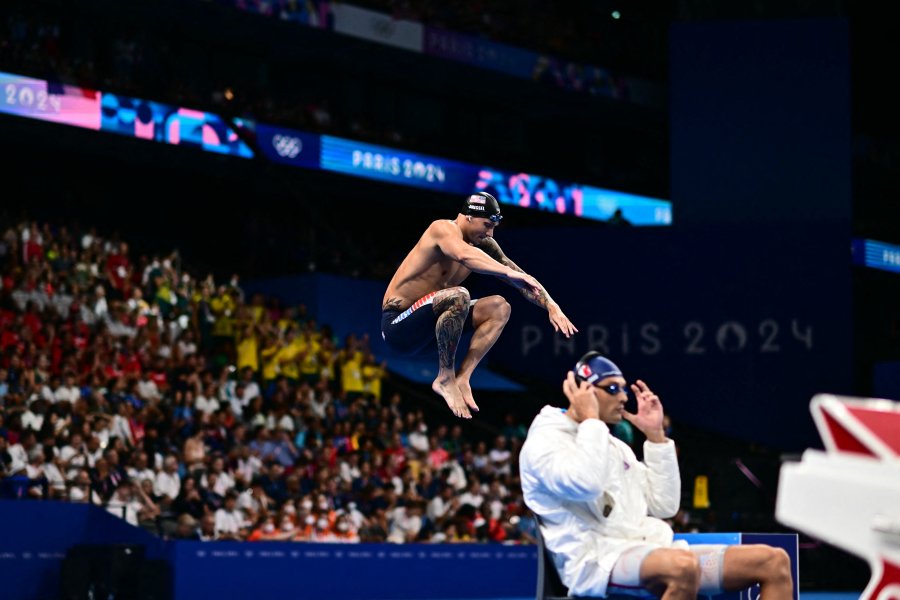 US' Caeleb Dressel jumps high in the air