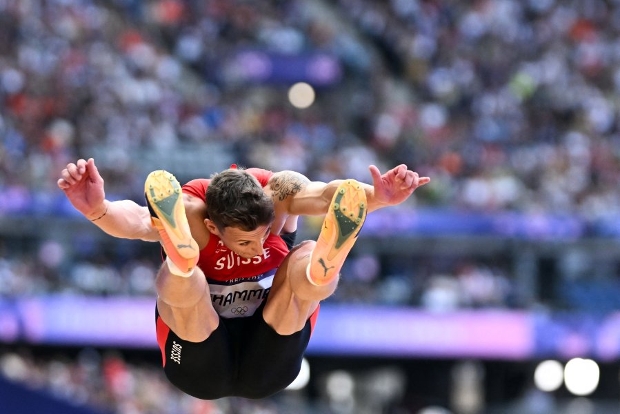 Switzerland's Simon Ehammer competes in the men's long jump qualification of the athletics event at the Paris 2024 Olympic Games at Stade de France in Saint-Denis, north of Paris, on August 4, 2024