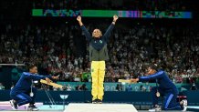 TOPSHOT - (LtoR) US' Simone Biles (silver), Brazil's Rebeca Andrade (gold) and US' Jordan Chiles (bronze) pose during the podium ceremony for the artistic gymnastics women's floor exercise event of the Paris 2024 Olympic Games at the Bercy Arena in Paris, on August 5, 2024. (Photo by Gabriel BOUYS / AFP) (Photo by GABRIEL BOUYS/AFP via Getty Images)