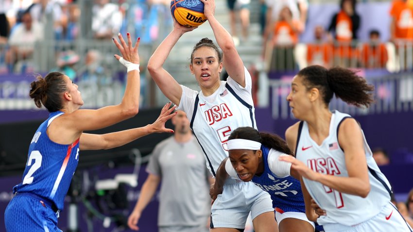 PARIS, FRANCE – AUGUST 02: Dearica Hamby #5 of Team United States looks to pass the ball during the Women’s 3×3 Basketball Pool Round match between Team United States and Team France on day seven of the Olympic Games Paris 2024 at Esplanade Des Invalides on August 02, 2024 in Paris, France. (Photo by Lintao Zhang/Getty Images)