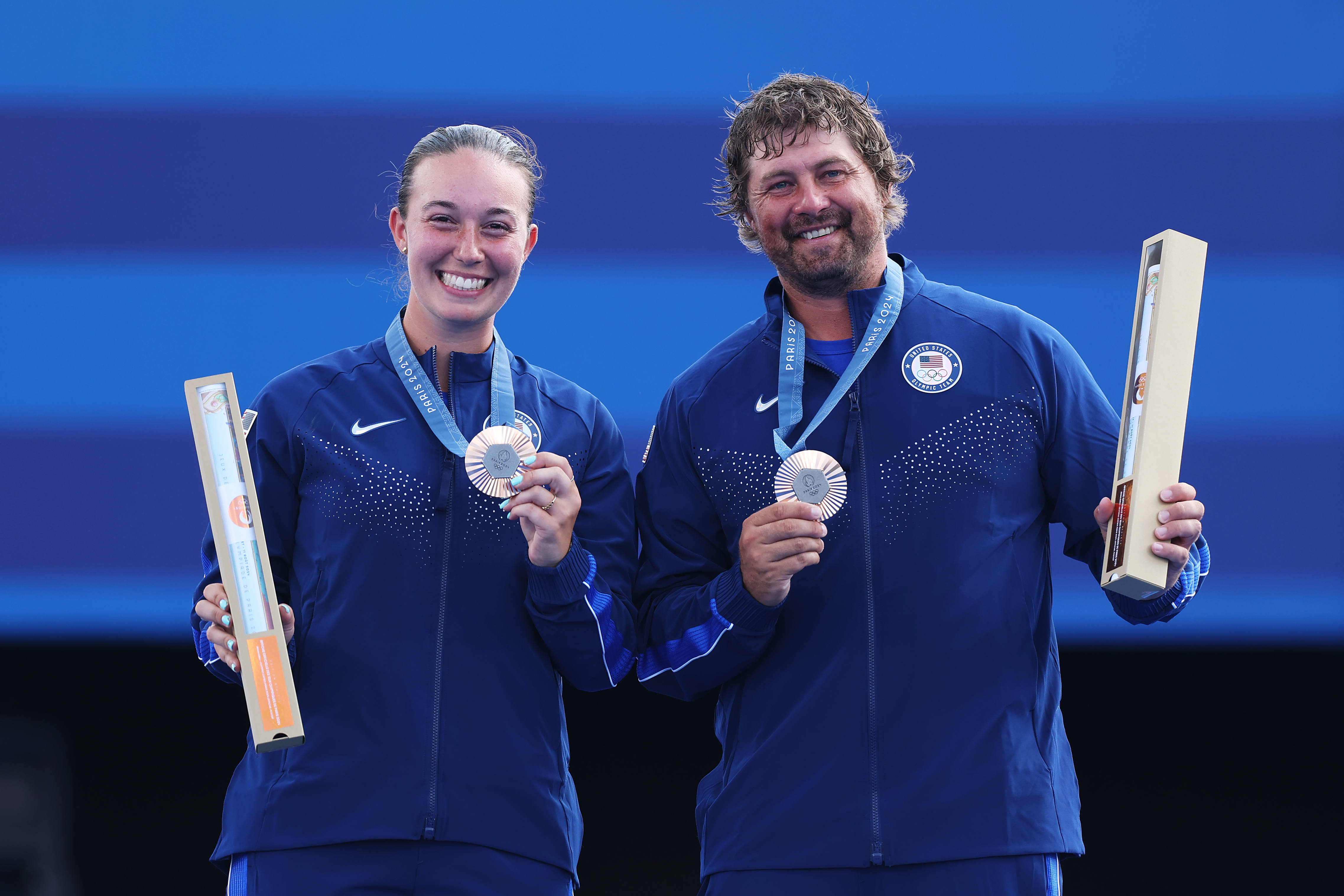 Bronze medalists Casey Kaufhold and Brady Ellison, of Chula Vista, ose on the podium during the Archery Mixed Team on Day 7 of the Olympic Games Paris 2024 at Esplanade Des Invalides on Aug. 2, 2024 in Paris, France.