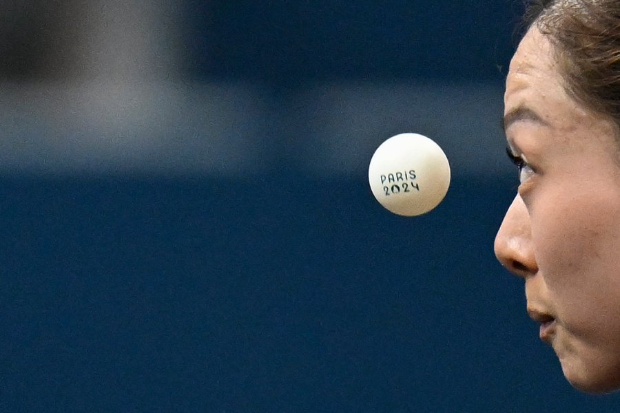 Germany's Yuan Wan eyes the ball during her women's table tennis singles match in the team round of 16 between USA and Germany at the Paris 2024 Olympic Games at the South Paris Arena in Paris on August 6, 2024