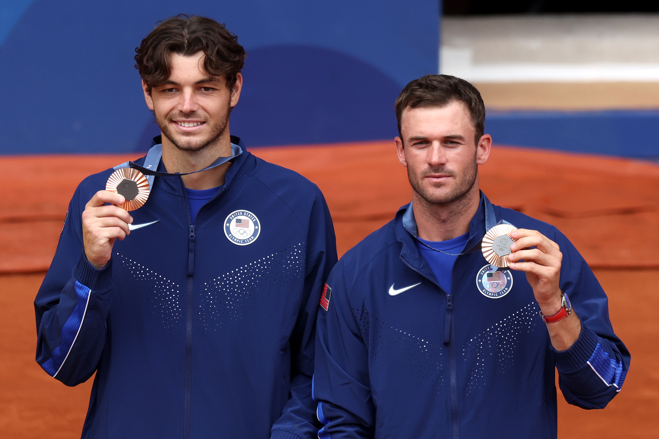 Bronze medalists Taylor Fritz (left), of Rancho Palos Verdes, and Tommy Paul of Team United States pose after their men's double match at the Paris Olympics.