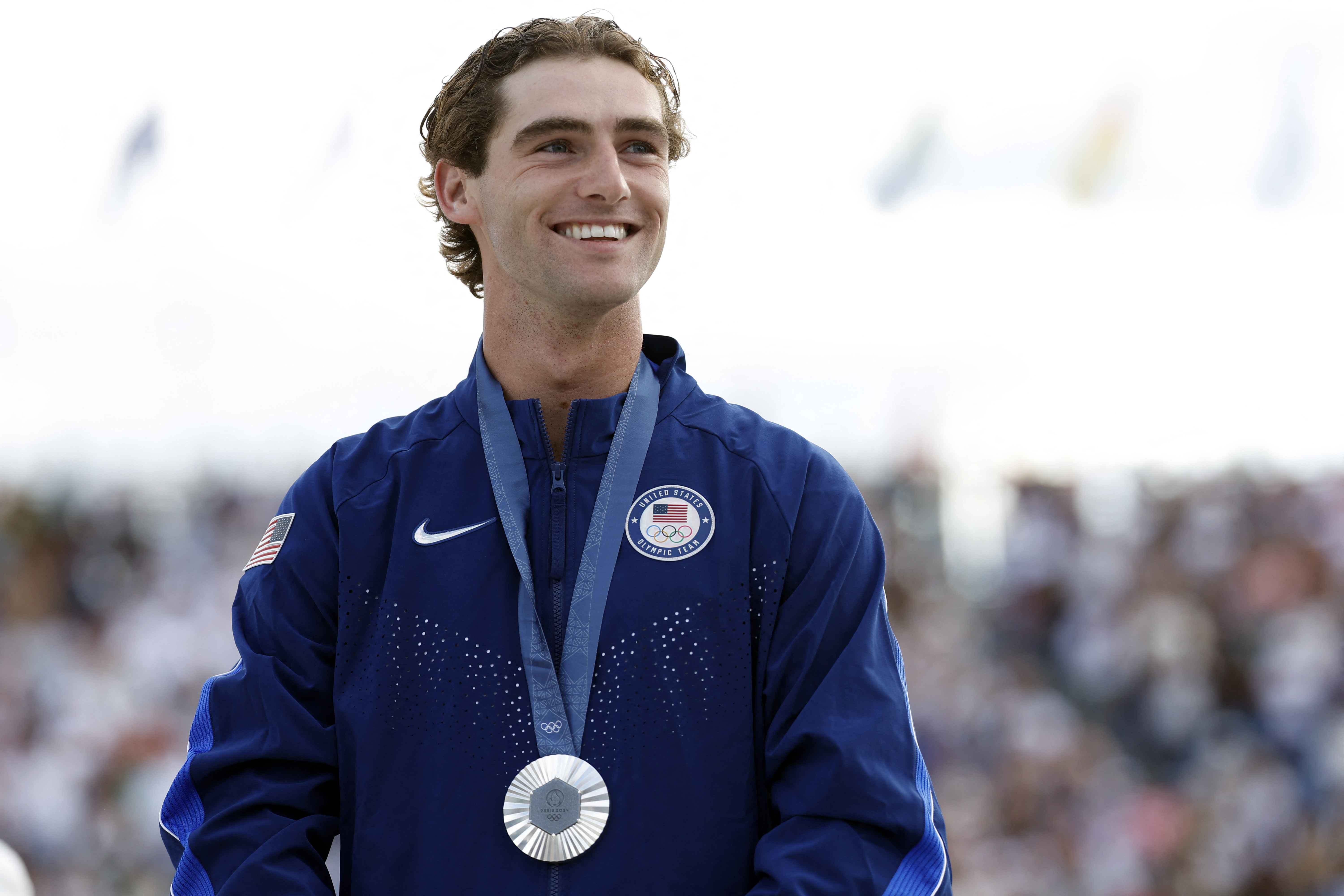 Silver medalist US’ Tom Schaar, of Malibu, poses during the podium ceremony for the men’s park skateboarding final during the Paris 2024 Olympic Games at La Concorde in Paris on August 7, 2024.