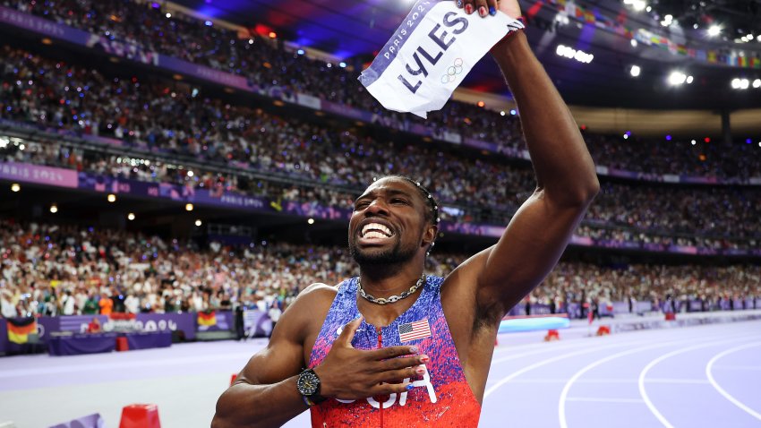 Noah Lyles celebrates