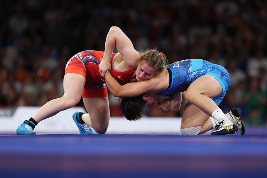 Amit Elor of Team United States (red) competes with Meerim Zhumanazarova of Team Kyrgyzstan (blue)