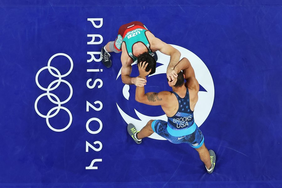 Javrail Shapiev of Team Uzbekistan (red) competes with Aaron Marquel Brooks of Team USA(blue)