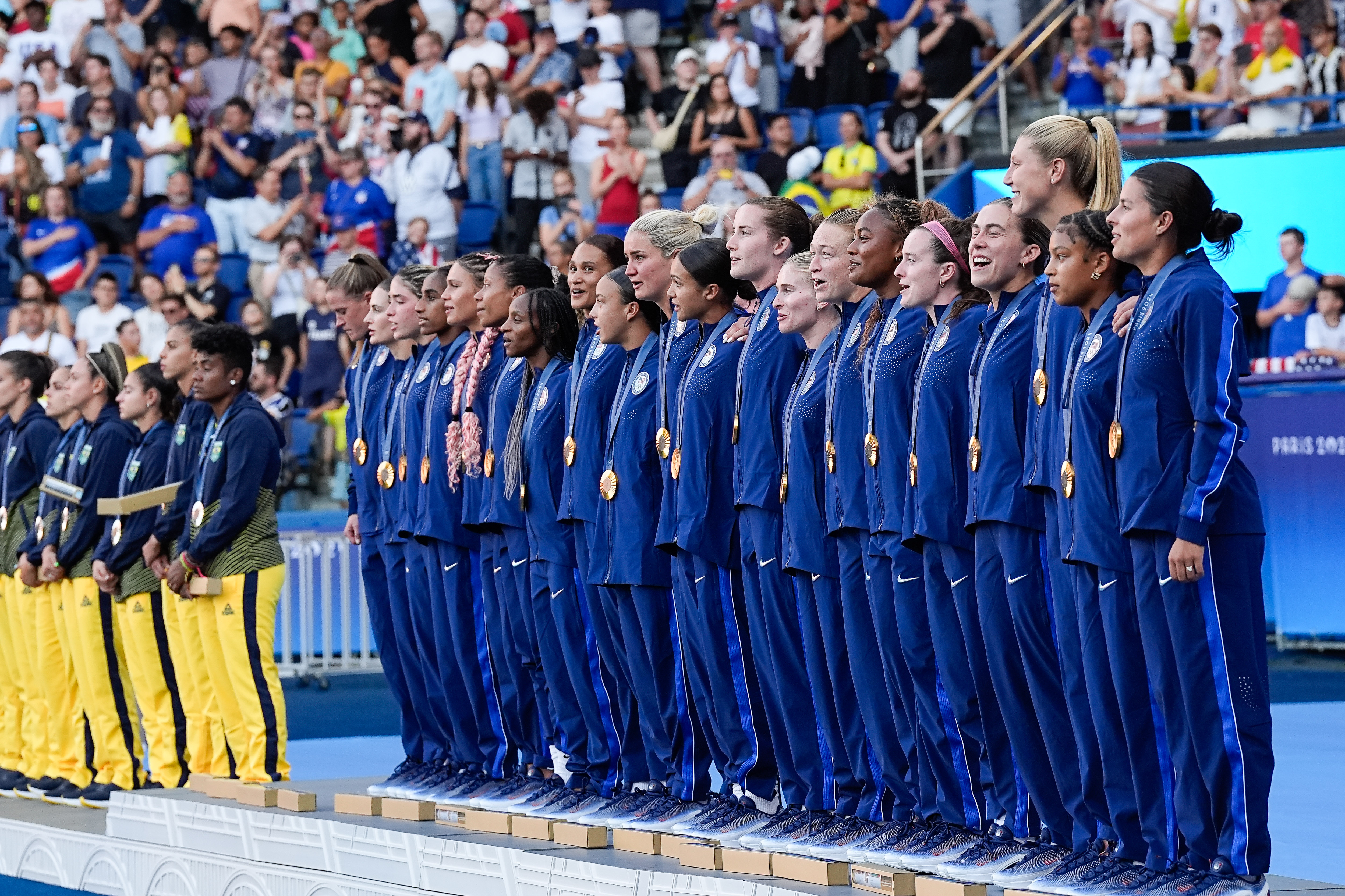 Trinity Rodman, of Laguna Beach, Jenna Nighswonger, of Huntington Beach, and Lynne Williams, of Pepperdine, won gold for Team USA in women's soccer at the Paris Olympics.