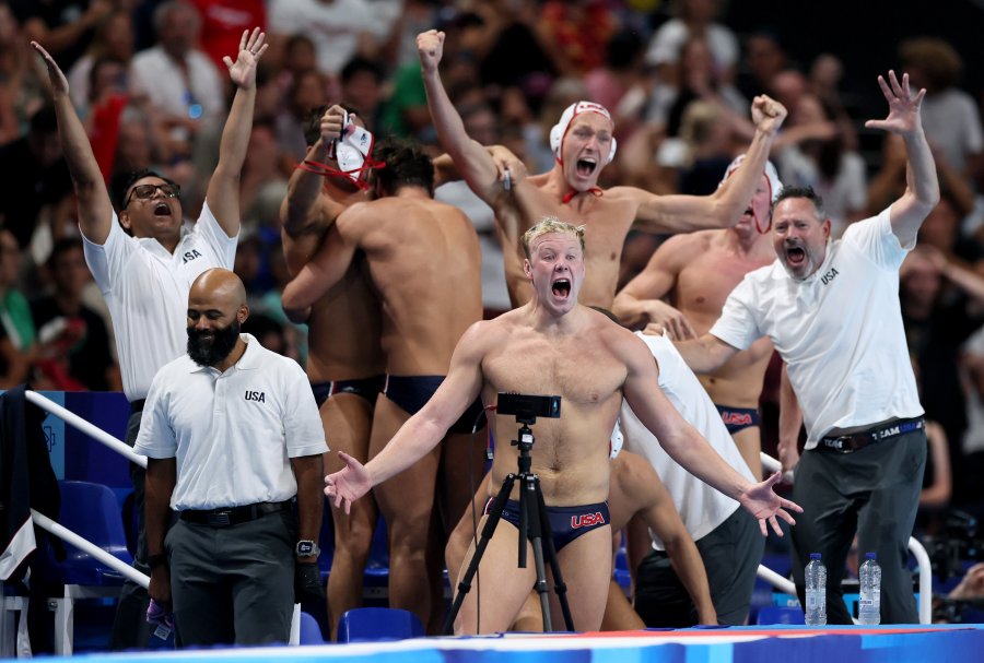 Team United States celebrate on the sideline after victory in the Bronze Medal match between Team United States and Team Hungary on day sixteen of the Olympic Games Paris 2024 at Paris La Defense Arena on August 11, 2024 in Nanterre, France