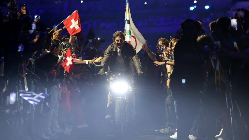 PARIS, FRANCE – AUGUST 11: American Actor and Film Producer Tom Cruise carries the IOC Flag during the Closing Ceremony of the Olympic Games Paris 2024 at Stade de France on August 11, 2024 in Paris, France. (Photo by Jamie Squire/Getty Images)