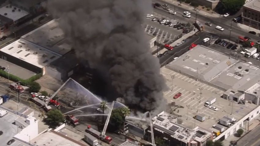 Firefighters responded to a fire at a business Tuesday Aug. 27, 2024 in downtown Los Angeles.