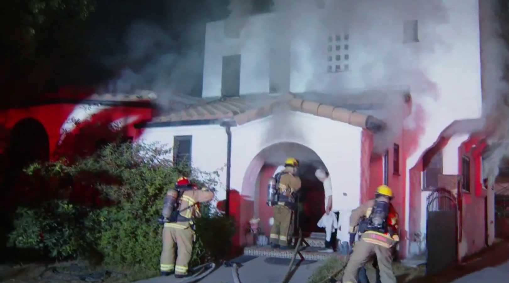 Firefighters rescue 2 people and dog in North Hollywood house fire