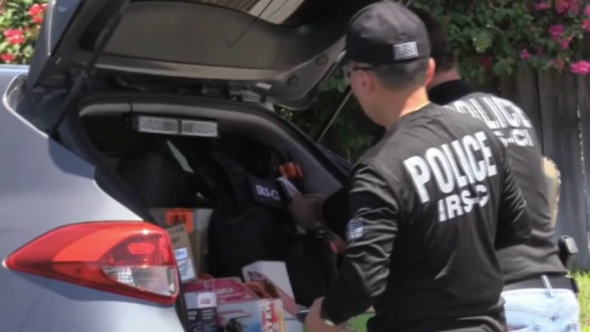 Federal agents at the scene of an Orange County law enforcement operation Thursday Aug. 22, 2024.