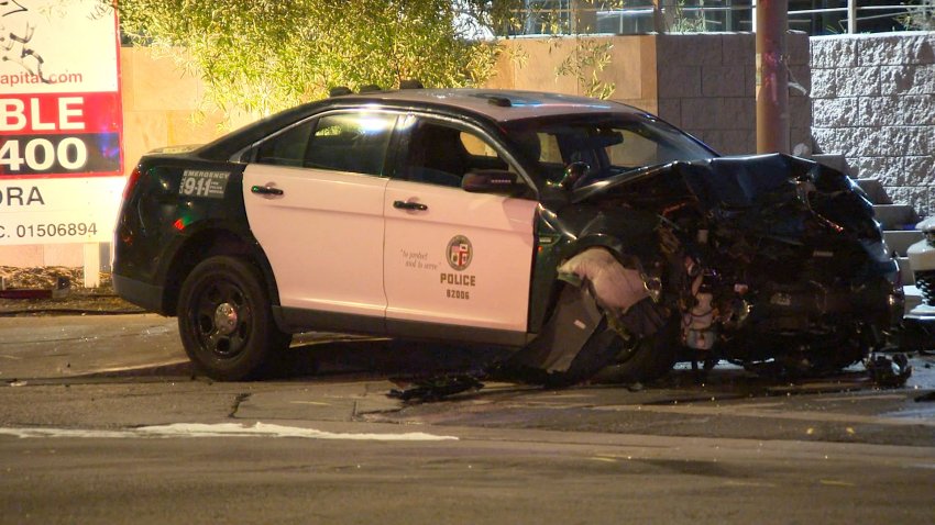 A wrecked LAPD patrol car could be seen at the intersection of Balboa and Burbank Blvds in Encino in June.