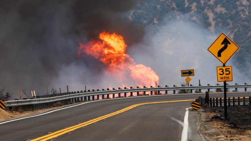 HIGHLAND, CA – SEPTEMBER 8, 2024: Erratic winds  create small firestorms along the side of Highway 330 during the Line fire on September 8,  2024 in Highland, California. (Gina Ferazzi / Los Angeles Times via Getty Images)