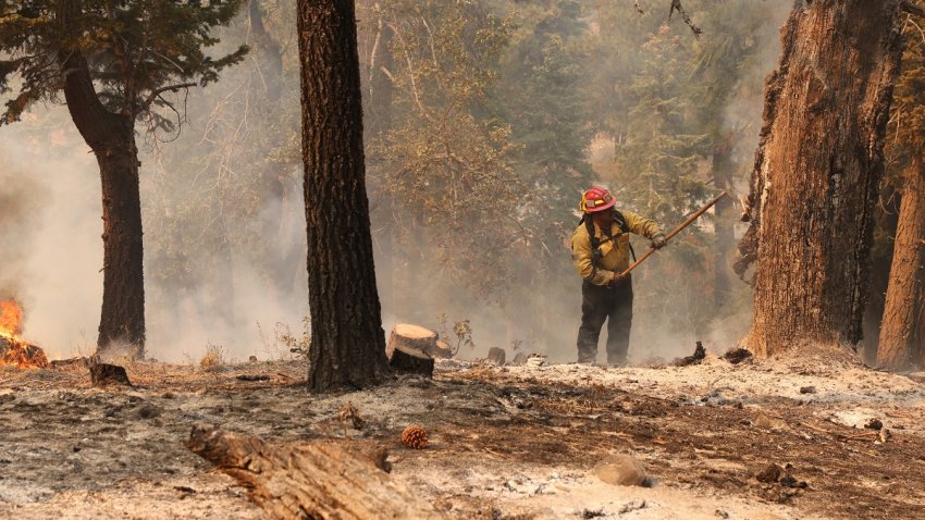 A firefighter battles against the wildfire, dubbed the Bridge Fire, in the Angeles National Forest near the border between Los Angeles and San Bernardino Counties, in California, the United States, on Sept. 13, 2024. The Bridge Fire, breaking out in the Angeles National Forest in Los Angeles County, has spread into San Bernardino County of California. (Photo by Qiu Chen/Xinhua via Getty Images)