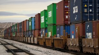 A freight train carries cargo shipping containers in the El Paso Sector along the US-Mexico border between New Mexico and Chihuahua state on December 9, 2021 in Sunland Park, New Mexico.