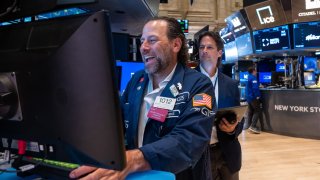 Traders work on the floor of the New York Stock Exchange on Aug. 14, 2024.