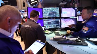 Traders work on the floor of the New York Stock Exchange during morning trading on Sept. 4, 2024.