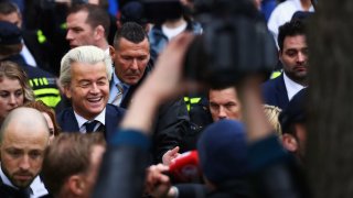 Geert Wilders speaks to the crowd, the media and shakes hands with supporters in 2017 in Spijkenisse, Netherlands. 