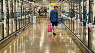 A customer shops at a Whole Foods grocery store in Edgewater, N.J. on Sept. 11th, 2024.