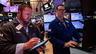 Traders work on the floor of the New York Stock Exchange on September 18, 2024 in New York City.