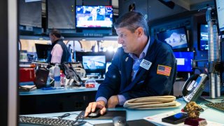 Traders work on the floor of the NYSE. 