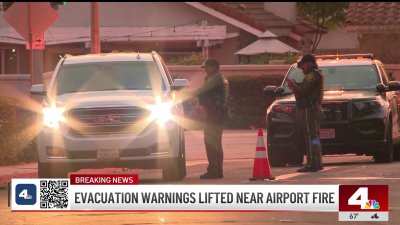 Evacuation warnings lifted near Airport Fire as crews make progress