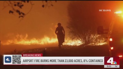 Firefighter rescues woman surrounded by Airport Fire