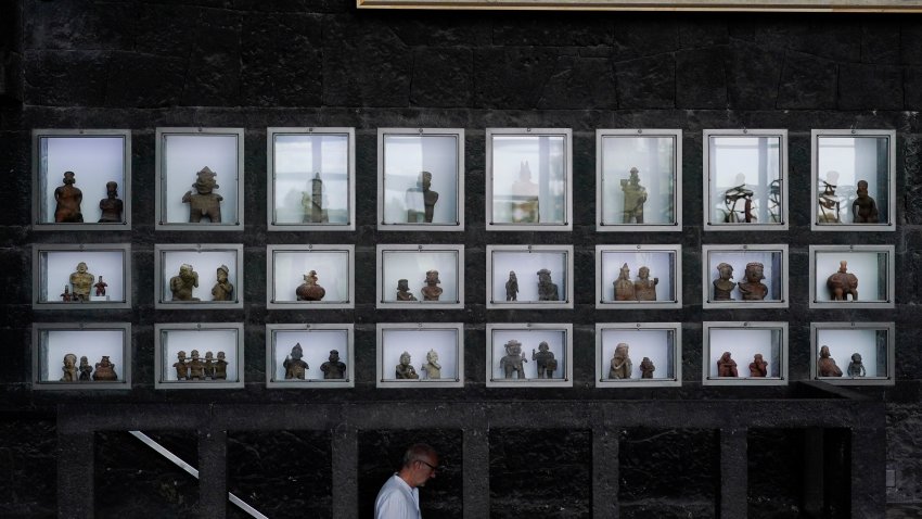 Pre-hispanic ceramics are displayed in glass front niches in the Anahuacalli Museum