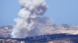 Smoke rises from Israeli airstrikes on villages in the Nabatiyeh district, seen from the southern town of Marjayoun, Lebanon, Monday, Sept. 23, 2024.