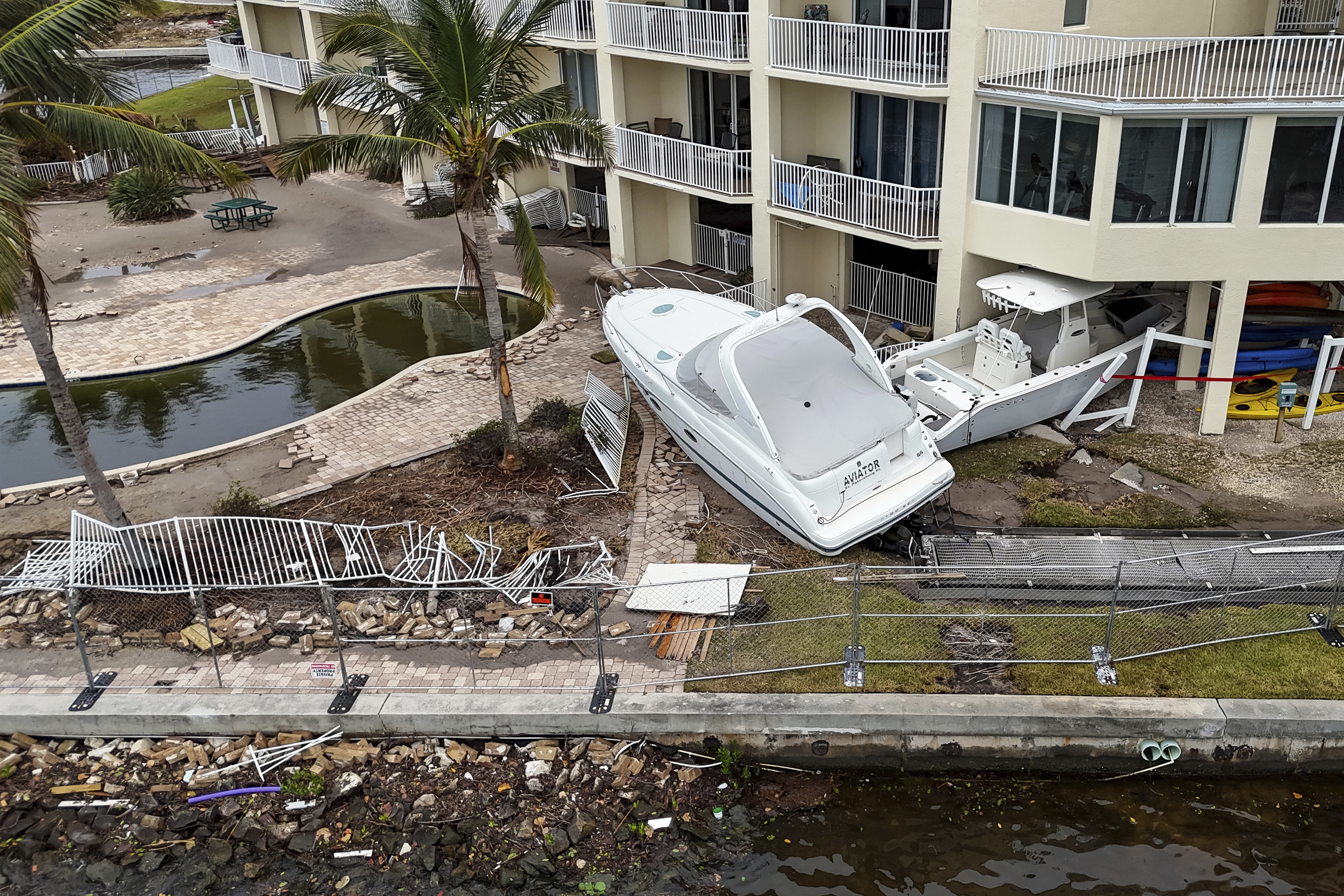 Boats sit after being pushed ashore by floodwaters from Hurricane Helene on Saturday, Sept. 28, 2024, in St. Petersburg, Fla.