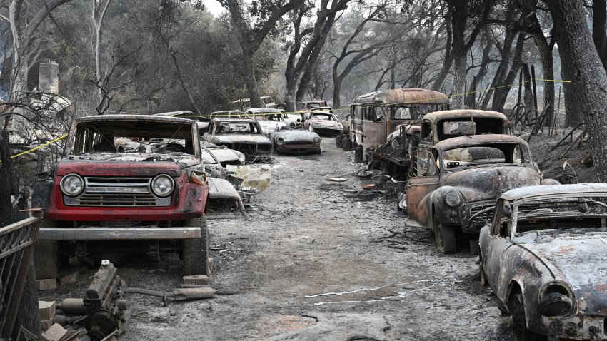 A view of burnt vehicles and structures during the wildfire as called Airport Fire in Orange County, California.