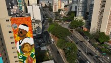 Jalen Hurts and Jordan Love depicted on large mural in São Paulo, Brazil.