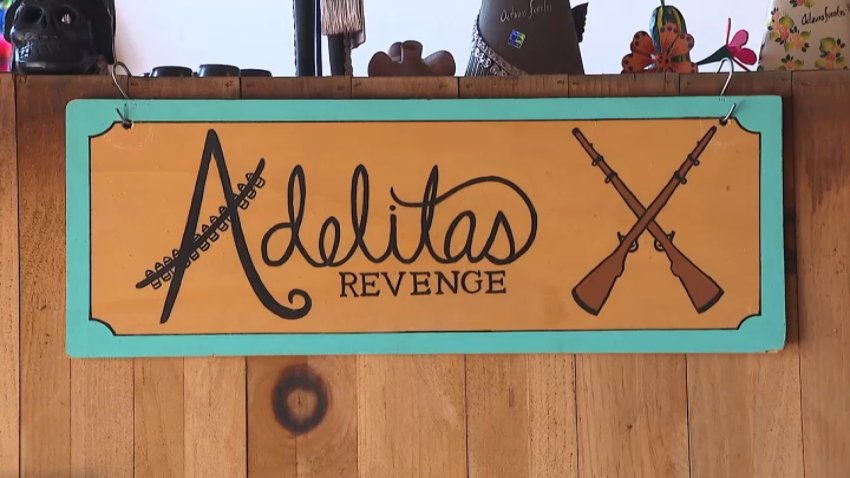 A sign for Adelitas shop in Long Beach.