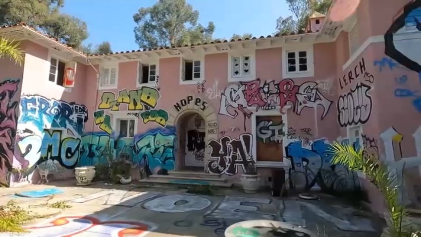 A Bel Air mansion on the 600 block of Stone Canyon Road is riddled with graffiti, as seen on Saturday, Sept. 28, 2024.