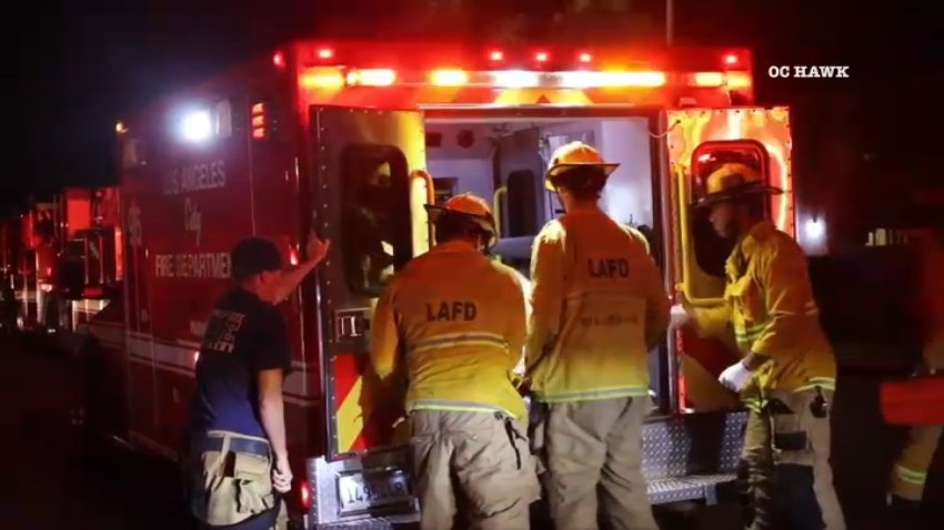 First responders tend to a shooting victim in Canoga Park on Saturday, Sept. 29, 2024.